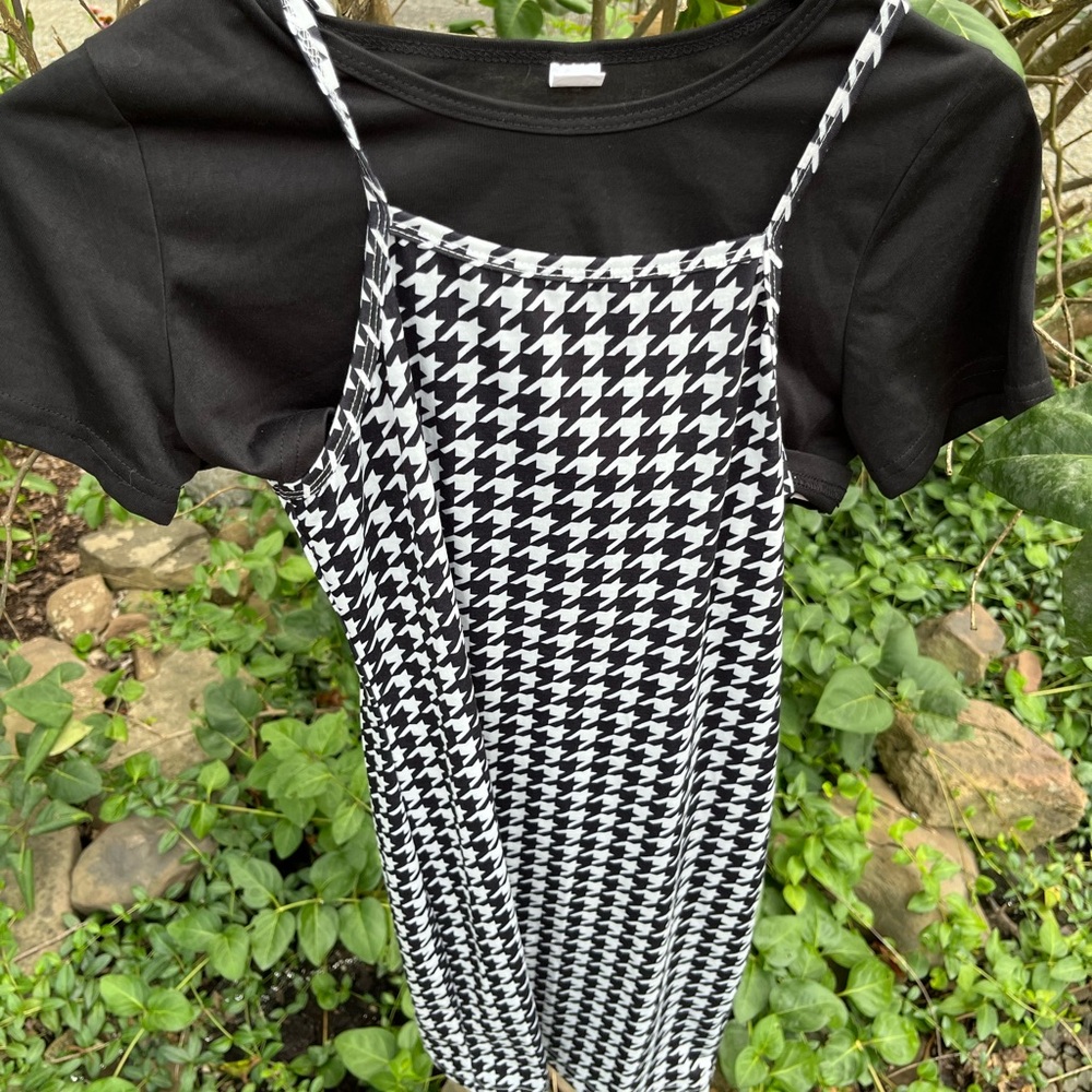 Black and white houndstooth jumper and black pullover.